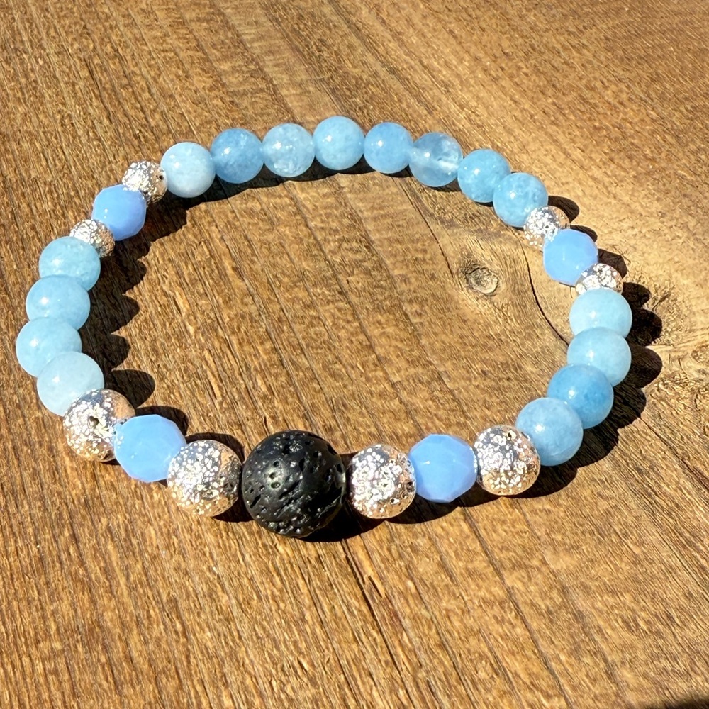 Blue Anhydrite and Silver Beaded Bracelet with Black lava bead as a focal.